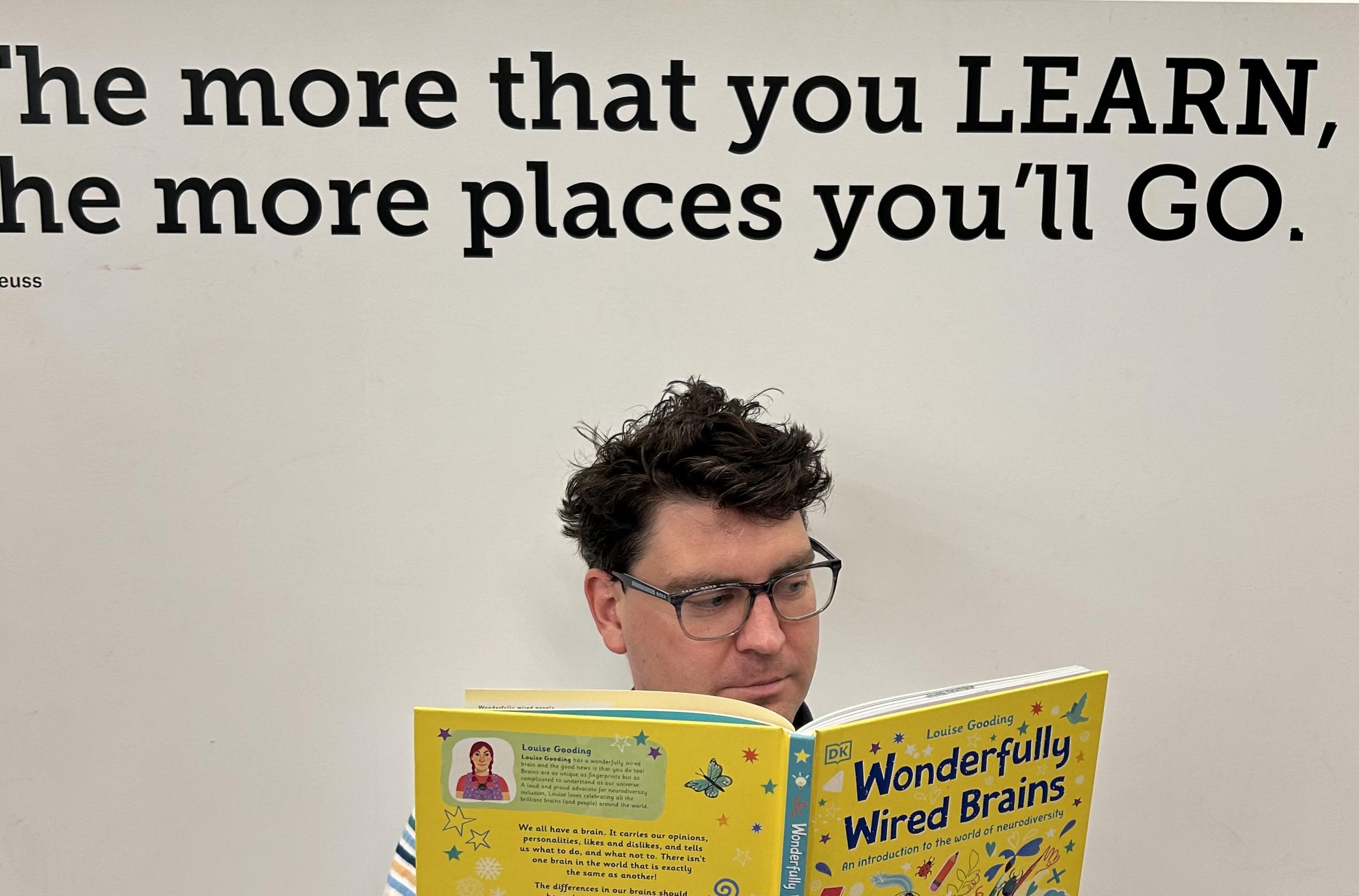 man reading in the library